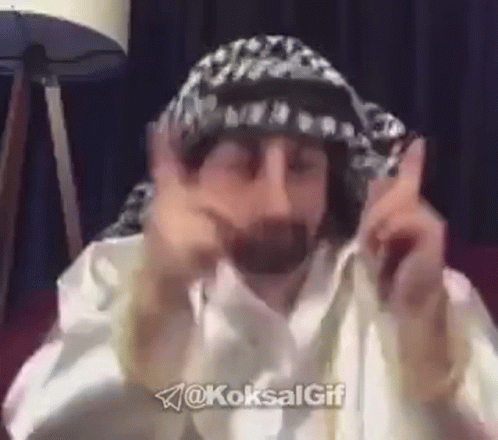 Man With Hat And Scarf Making Funny Face GIF