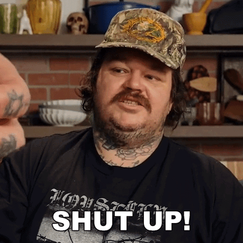 Man with Hat and Shut Up Shirt