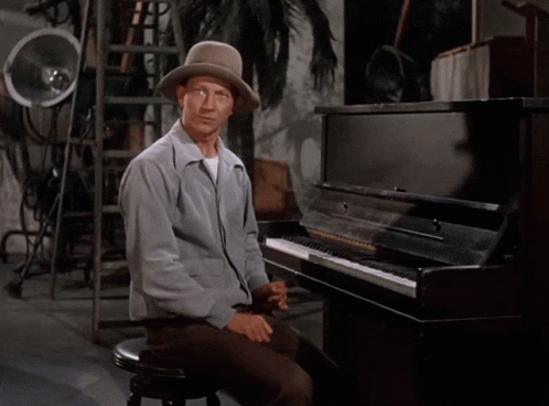 Man With Hat at Piano With No on Lap