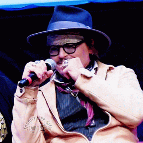 Man With Hat Glasses Holding Microphone Tommytype Gigg Jacket