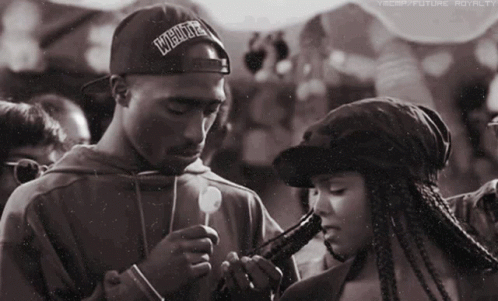 Man With Hat Saying Underground Smoking Beside Woman GIF