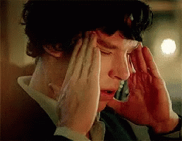 Man With Headache Holding Head GIF