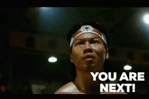 Man with Headband Saying You Are Next