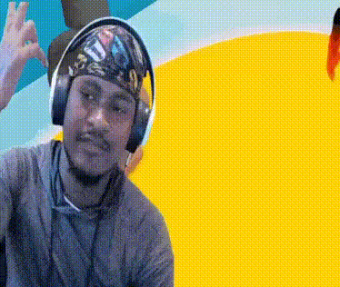 Man with Headphones and Bandana Giving OK Sign