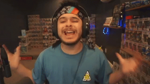 Man With Headphones and Bandana Saying A Ton
