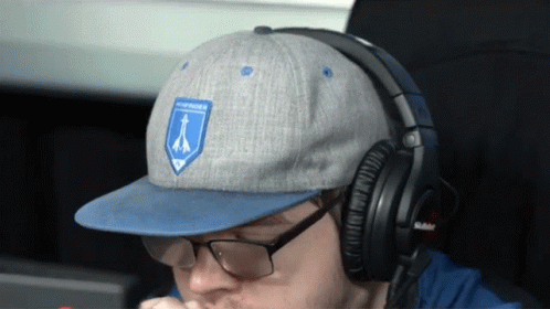 Man With Headphones and Blue Northern Patch Hat
