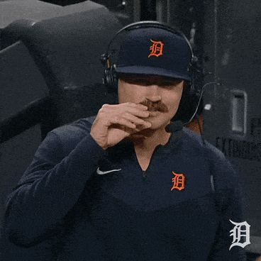 Man With Headphones and Detroit Hat