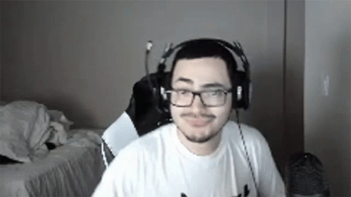 Man With Headphones and Glasses at Computer
