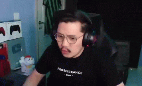 Man With Headphones and Glasses at Computer