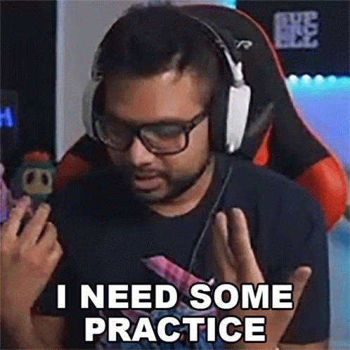 Man With Headphones and Glasses in Gaming Chair Saying I Need Some Practice