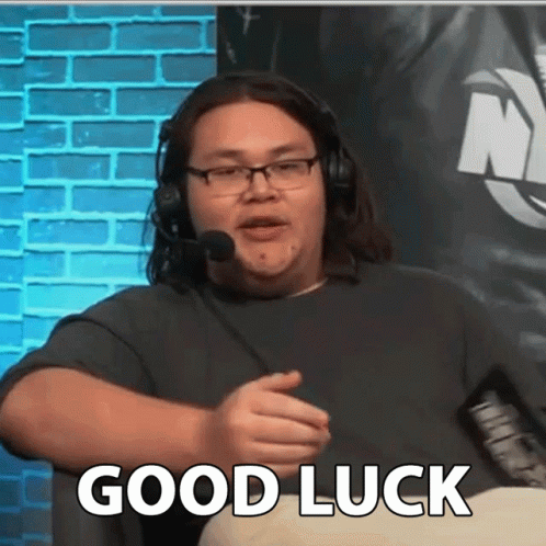 Man With Headphones and Glasses Saying Good Luck