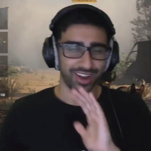 Man With Headphones And Glasses Smiling And Waving GIF