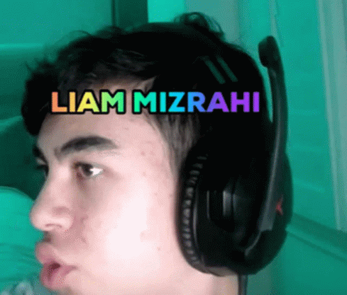 Man With Headphones and Liam Mizrahi on Forehead