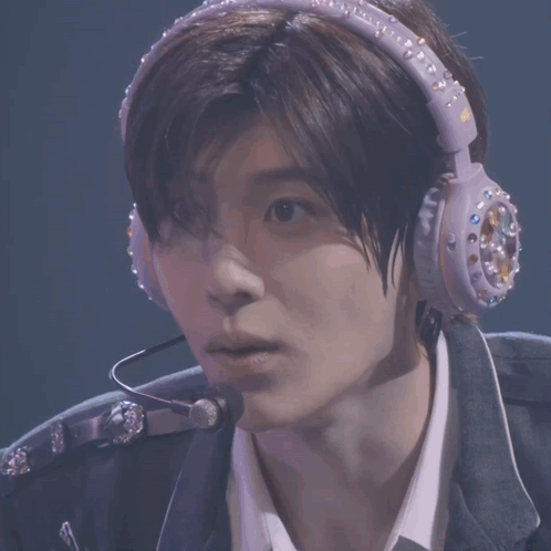 Man with Headphones and NCT Badge