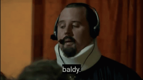 Man With Headphones and Neck Brace Says Baldy