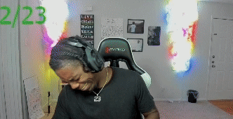 Man with Headphones and Number 23 Necklace