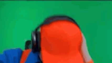 Man With Headphones and Orange Hat Listening to Music