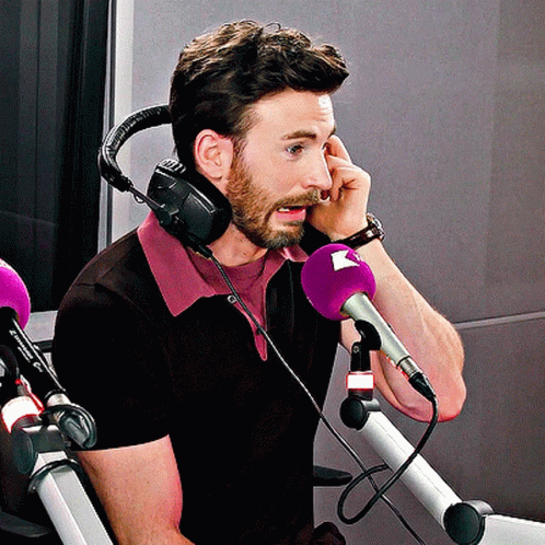 Man With Headphones and Purple Microphone