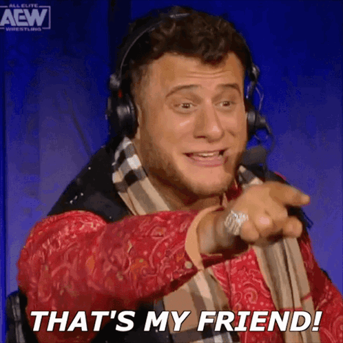 Man With Headphones And Scarf Pointing That's My Friend GIF