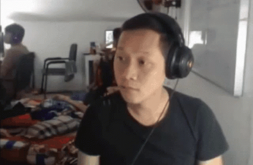 Man With Headphones and Serious Look