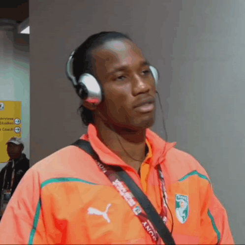 Man With Headphones And Sony Lanyard GIF