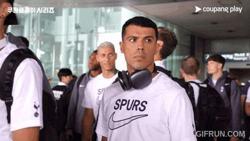 Man With Headphones and Spurs Shirt