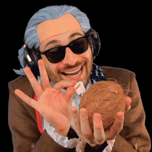 Man With Headphones and Sunglasses Holding Coconut