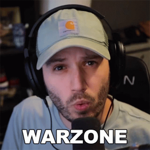 Man With Headphones and Warzone Hat