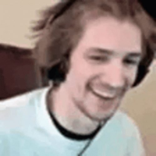 Man With Headphones and White Shirt Smiling