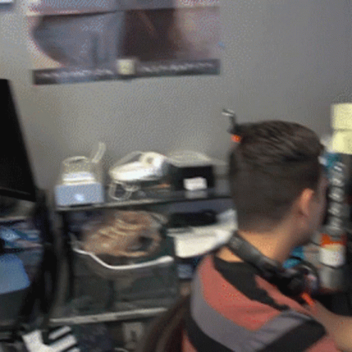 Man with Headphones at Computer Desk