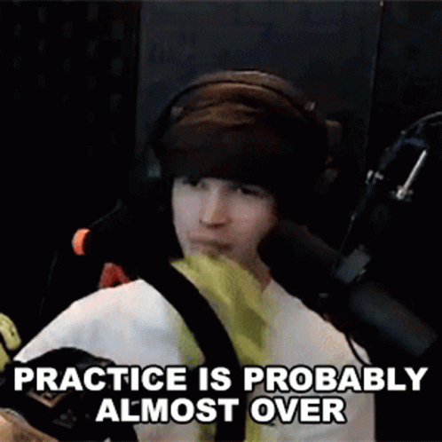Man With Headphones at Microphone Says Practice Is Probably Almost Over