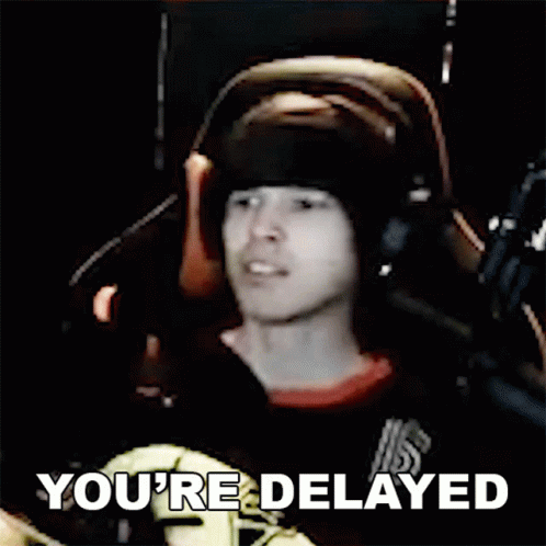 Man with Headphones at Microphone Says You're Delayed