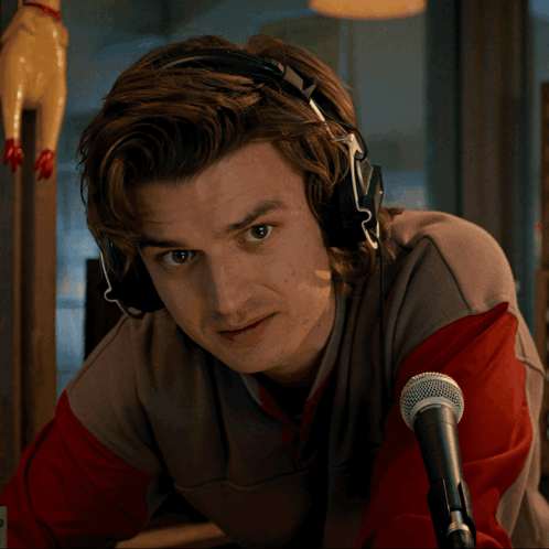 Man with Headphones at Shure Microphone
