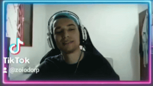 Man With Headphones at Tik Tok Logo