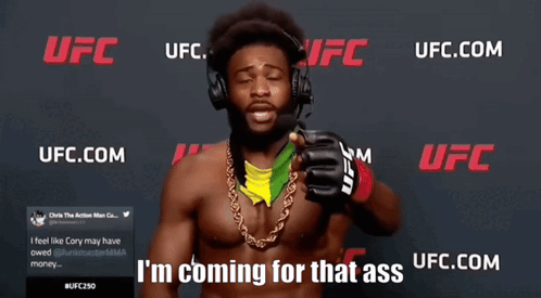 Man With Headphones at UFC Banner