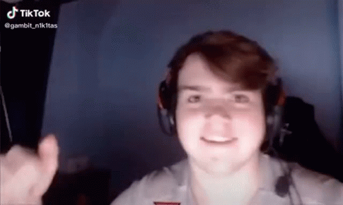 Man With Headphones Giving Thumbs Up