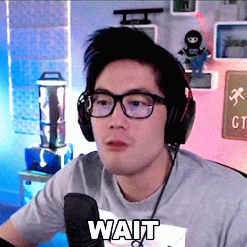 Man With Headphones, Glasses, and Wait Shirt