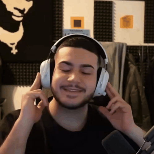 Man With Headphones Holding Comb GIF