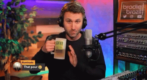 Man With Headphones Holding Mug Saying That Pour GIF