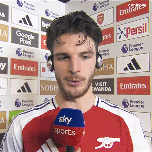 Man With Headphones Holding Sky Sports Microphone