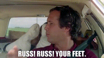 Man With Headphones In Car Saying Russ Russ Your Feet GIF