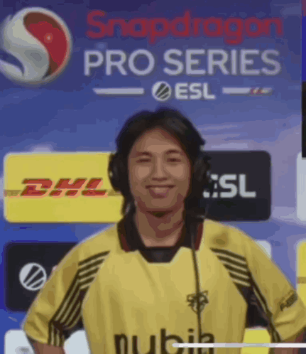 Man With Headphones In Front Of Snapdragon Pro Series Banner GIF