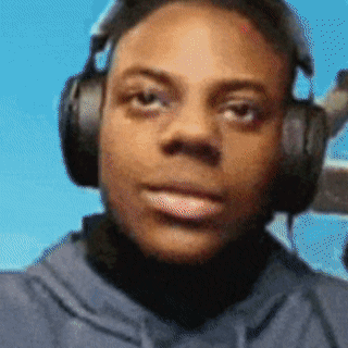 Man With Headphones Looking at Blue Sky