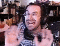 Man With Headphones Making Funny Face at Mic