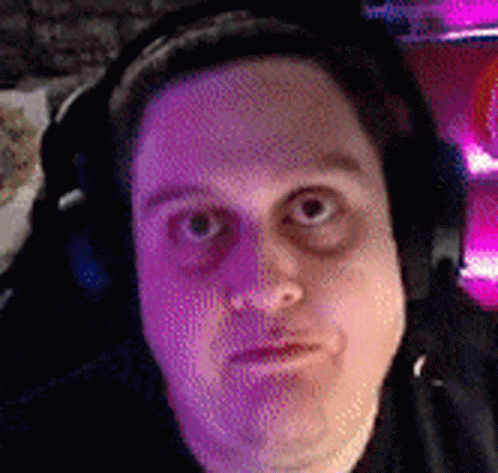 Man With Headphones Making Funny Face In Pink GIF