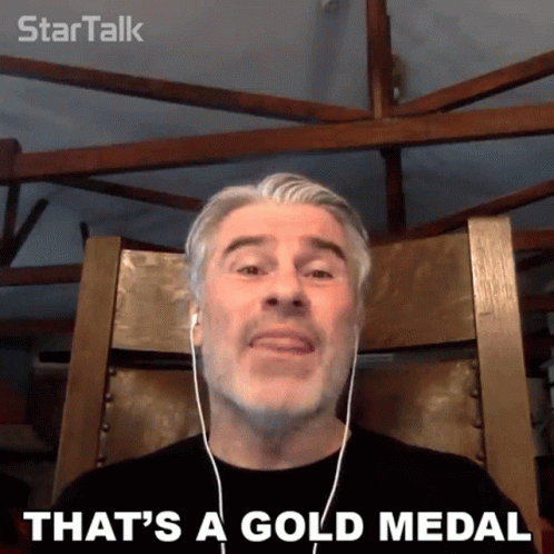 Man With Headphones Saying That's a Gold Medal