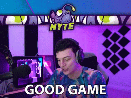 Man With Headphones Says Good Game in Front of Nyte Banner