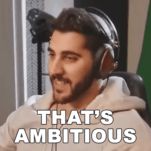 Man With Headphones Says That's Ambitious in Front of Green Screen
