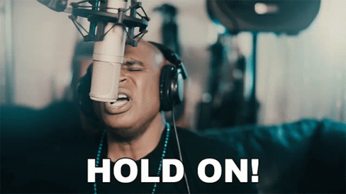 Man With Headphones Singing Hold On