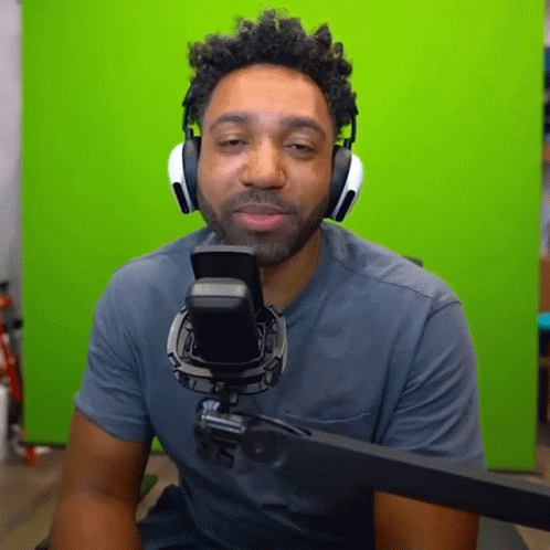 Man With Headphones Sitting At Microphone GIF